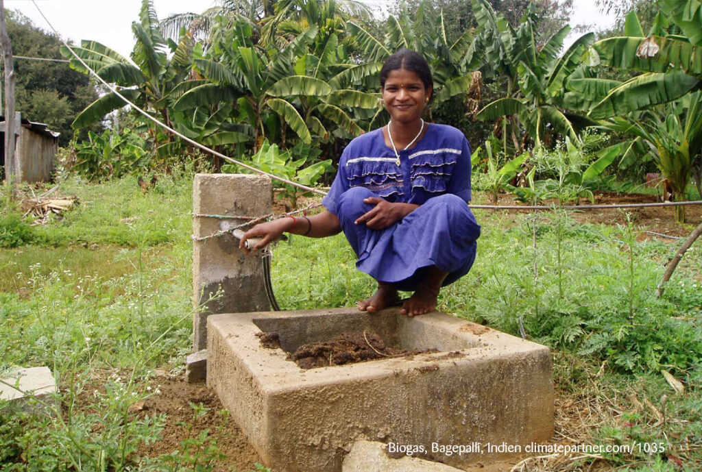 Woman standing at well in India